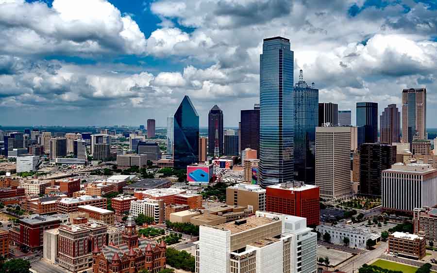 Dallas and Houston skylines representing garage management service areas across Texas